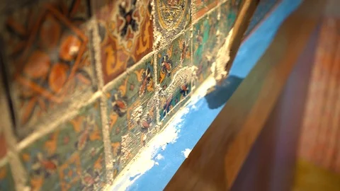 Closeup of hand applying grout to colorful tiles. Stock Footage 101434743