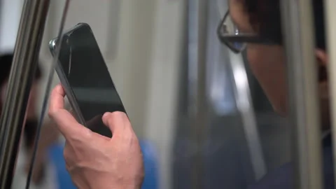 Closeup hand of businesspeople passenger using smartphone   sitting in subway Stock Footage 147234973