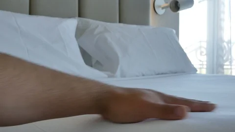 Closeup hand caressing white comfortable bed mattress 4k footage Stock Footage 112020781