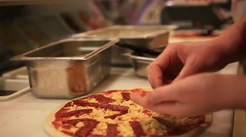 Closeup hand of chef baker in white uniform making pizza at kitchen. HD Stock Footage 48861558