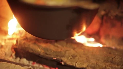 Closeup hand of chef recruited from a boiling pan portion of soup in a bowl Stock Footage 71943130