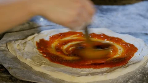 Closeup hand of chef Smears paste on dough. 4K Video. Stock Footage 100038959