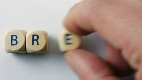 Closeup hand composing brexit word letter by letter. Conceptual video concerning Stock Footage 122952244