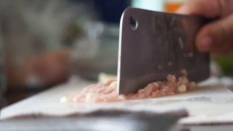 Closeup hand cutting pork preparing ingredient for cooking Stock Footage 130048408