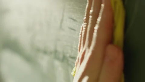 CloseUp of Hand Erasing Chalkboard Equations Stock Footage 277932084