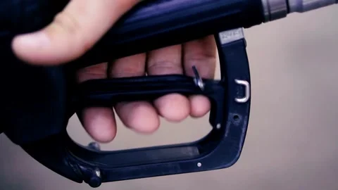 Closeup hand handle Refueling Car at Gas Station Pump in a Sunny Day Hand Vidéo 336561784