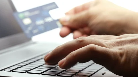 Closeup hand holding and using credit card typing on keyboard laptop	4k footage Stock Footage 111642719