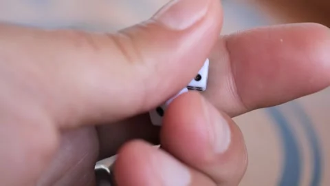 Closeup of hand holding backgammon dice in gameplay Vidéo 294999878