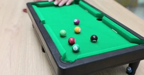 Closeup of hand holding cue about to shoot on pool table Video stock 291924352