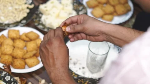 Closeup of Hand Holding Fried Chicken Piece at Food Stall Stock Footage 329384551