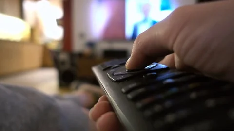 Closeup of a hand holding a remote control Stock Footage 71499532