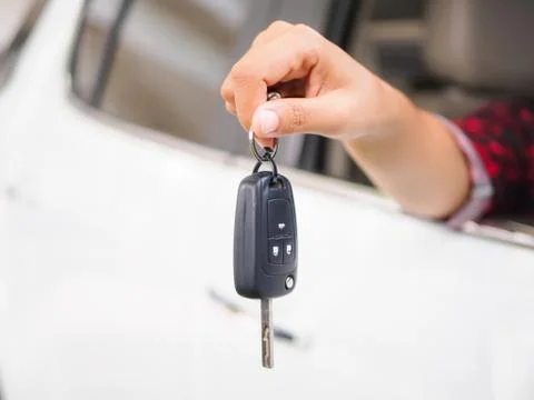 Closeup hand holding the remote control car alarm systems. Stock Photos