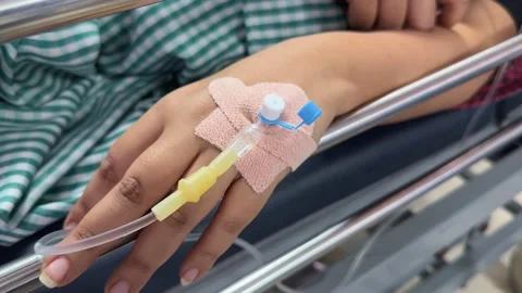 Closeup of hand with iv cannula 스톡 동영상 313913385