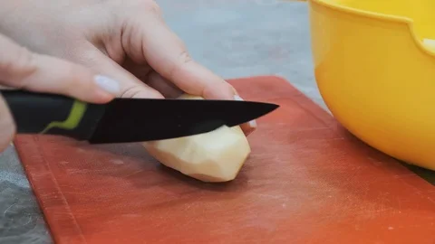 Closeup of hand with knife cutting fresh vegetable. Stock Footage 103280559