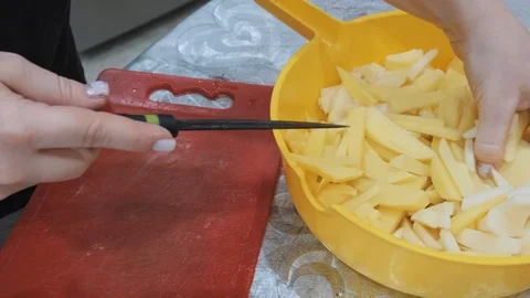 Closeup of hand with knife cutting fresh vegetable. Stock Footage 103280809
