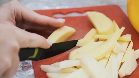 Closeup of hand with knife cutting fresh vegetable. Stock Footage 103281530