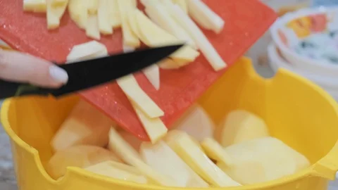 Closeup of hand with knife cutting fresh vegetable. Stock Footage 103281541