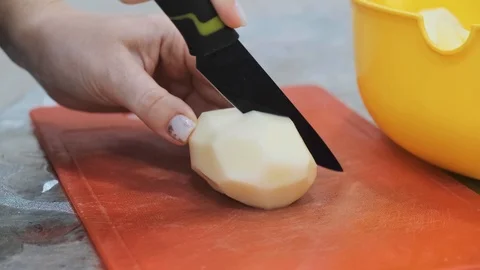Closeup of hand with knife cutting fresh vegetable. Stock Footage 103281633