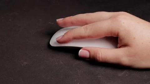 Closeup of hand making mouse click, click symbolizes focus and action, clic.. Stockbeeldmateriaal 320738578