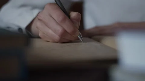 Closeup hand making notes, writing letter in personal diary, books. Library Stock-Footage 152588044