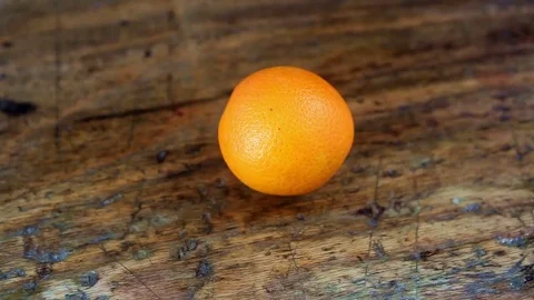 Closeup of hand of man cutting an orange Stock Footage 69149693
