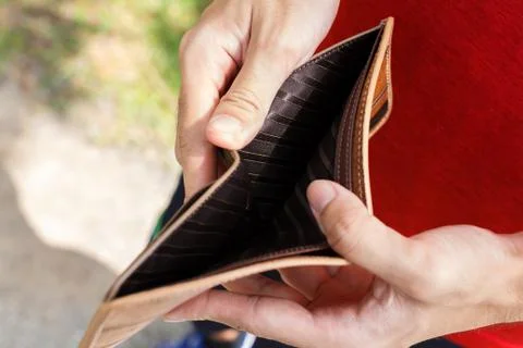 A Closeup hand man open an Empty Wallet. Stock Photos