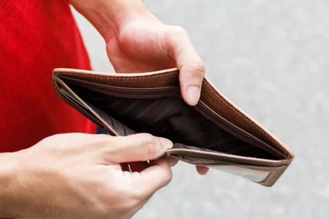 A Closeup hand man open an Empty Wallet. Stock Photos