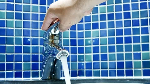 Closeup hand man opening and closing bathroom tap Stock Footage 89700688
