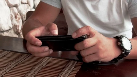 Closeup hand of man using phone in cafe Stock Footage 85155005