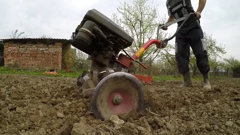 Closeup of hand motor plow blade throwing clay. Stock Footage 74793144