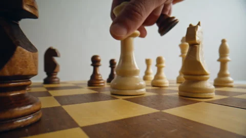 Closeup hand moving pawn piece chess board. Person playing logic strategy game Stock Footage 332310430