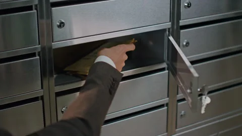 Closeup hand open mailbox in apartment building. Person in suit checking mail Stock Footage 262465487