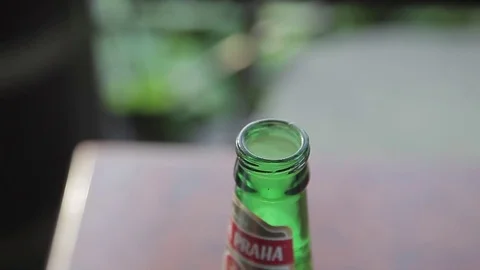 Closeup of the hand opens a bottle of beer in an unusual way Stock Footage 71944211