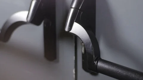 Closeup Hand Opens Door with Black Handle and it Closing back Stock Footage 76926501