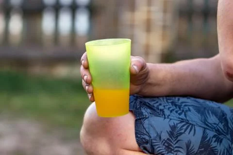 Closeup hand with plastic cups. Selective focus on hands Stock Photos