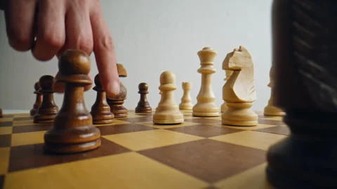 Closeup hand playing chess game to development strategy. Person shifting figure Stock Footage 332310380