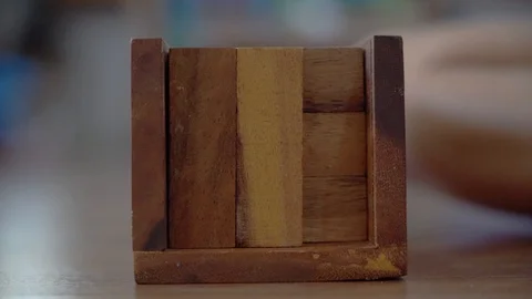 Closeup hand playing wooden block puzzle, Development or constructive concept in Stock Footage 121036282