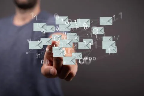 Closeup of the hand pointing at the floating email icons with binary numbers. 写真素材