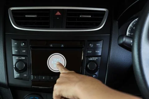 Closeup hand pushing start engine modern car Stock Photos