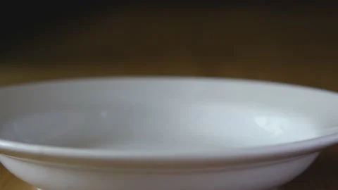 Closeup hand putting hot steam rice on white dish Stock Footage 130862876