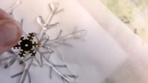 Closeup of hand putting a sequin on DIY glue Christmas decoration Stock Footage 196241538