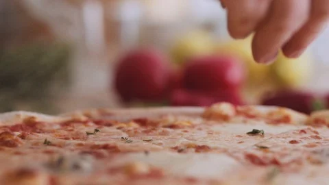 Closeup Hand putting Thyme on Pizza Slow Motion Stock Footage 92957128