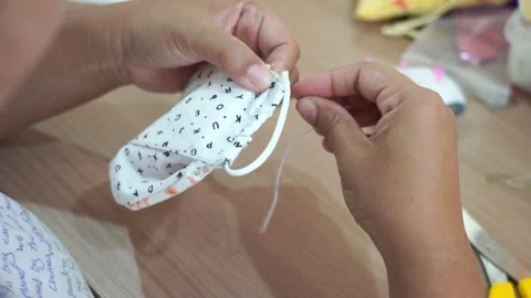 Closeup hand sewing and making DIY or handmade protective mask Stock-Footage 137498805