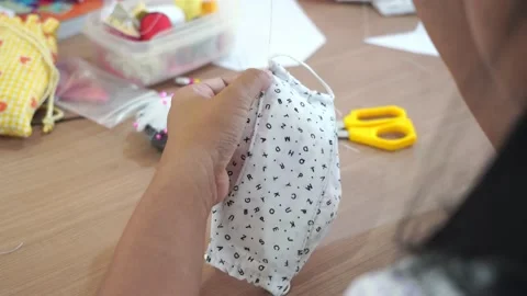 Closeup hand sewing and making DIY or handmade protective mask Stock Footage 137498855