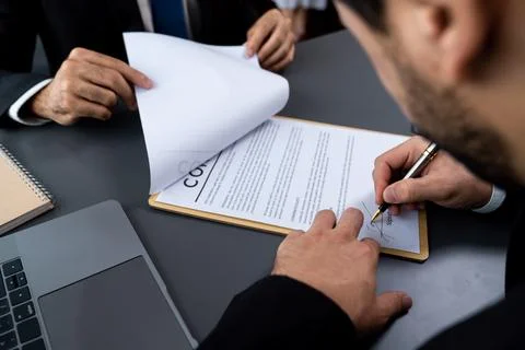 Closeup hand signing contract document with pen. Fervent. Stock Photos