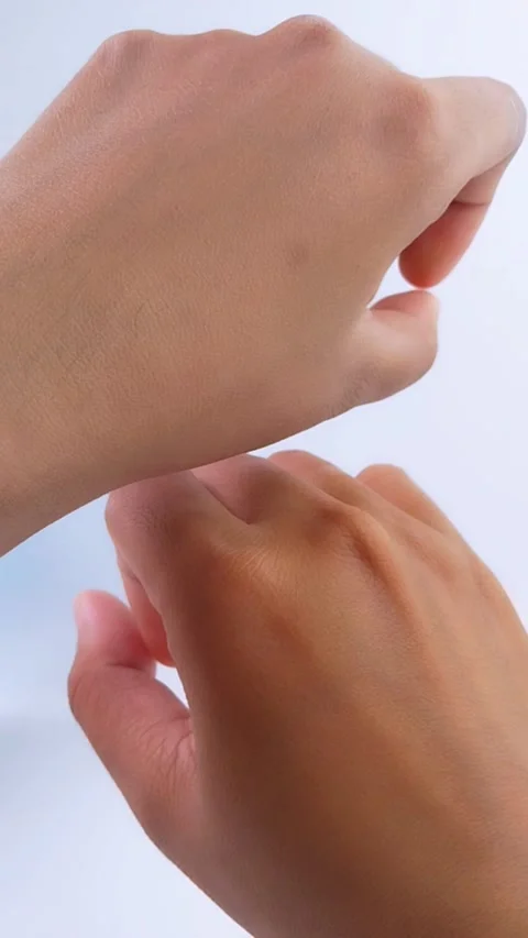 Closeup of hand skin tone comparison showing UV damage protection. Stock Footage 335388906