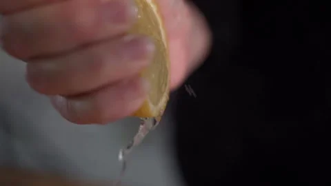 Closeup of hand squeezing lemon Stock Footage 131046897