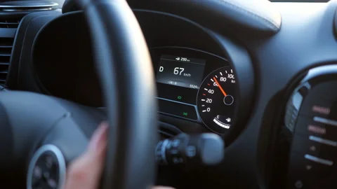 Closeup of hand on the steering wheel and speedometer Stock Footage 102835124