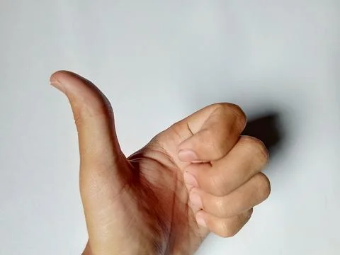 Closeup of a hand thumb Fotos Stock