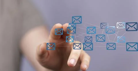 Closeup of a hand touching 3D rendered flying email icon Foto stock